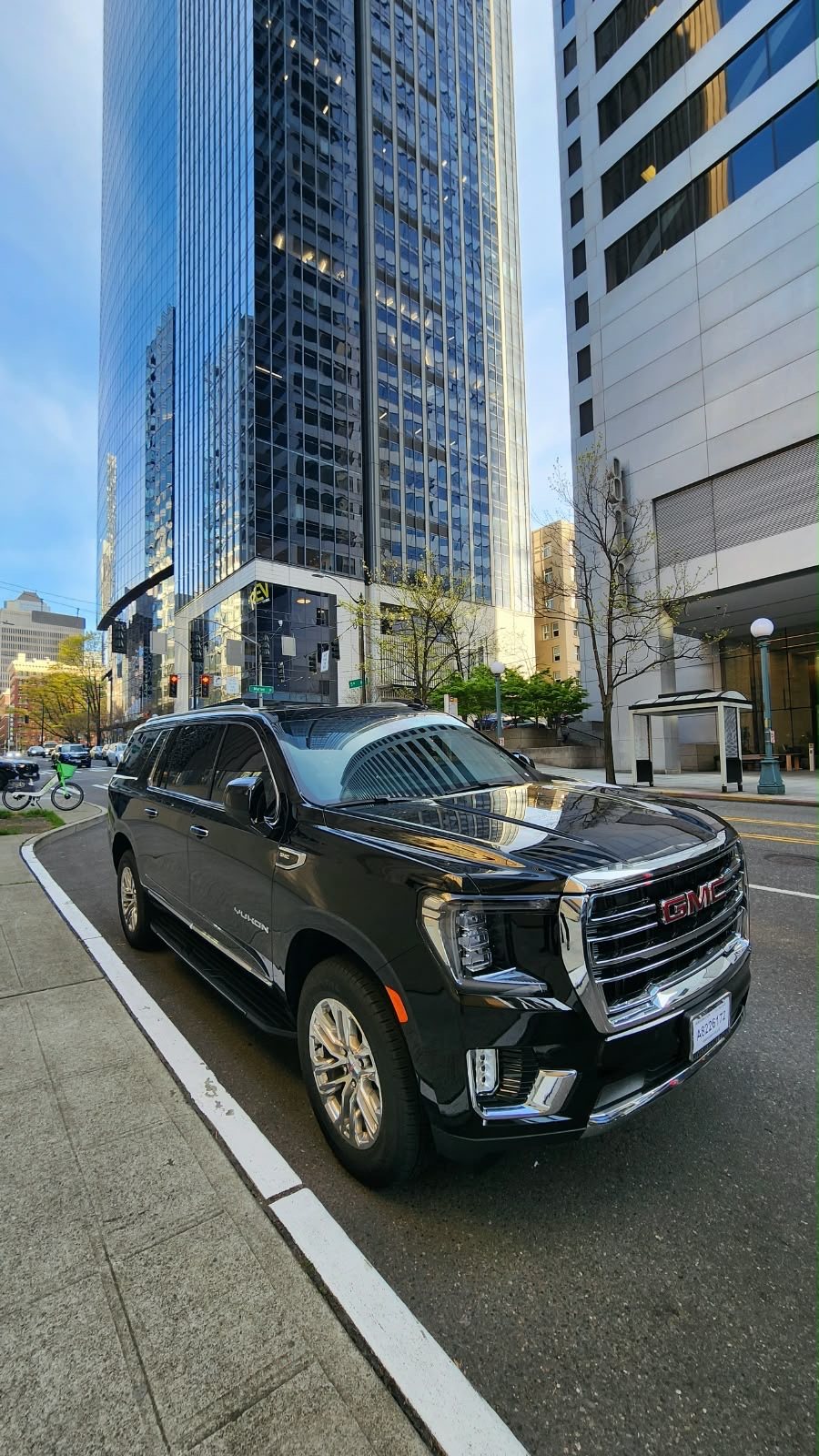 Black GMC Yukon premium SUV in downtown Seattle